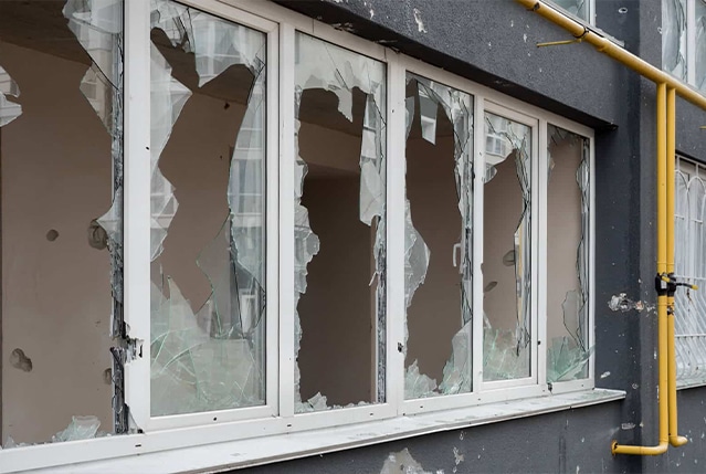 Broken windows of an abandoned building